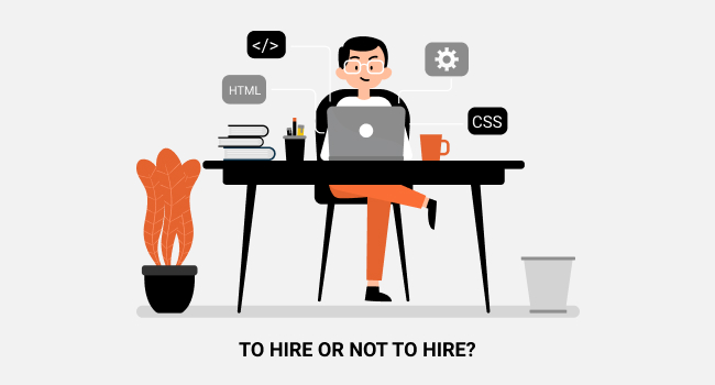 QA specialist sitting with a laptop at the desk and working